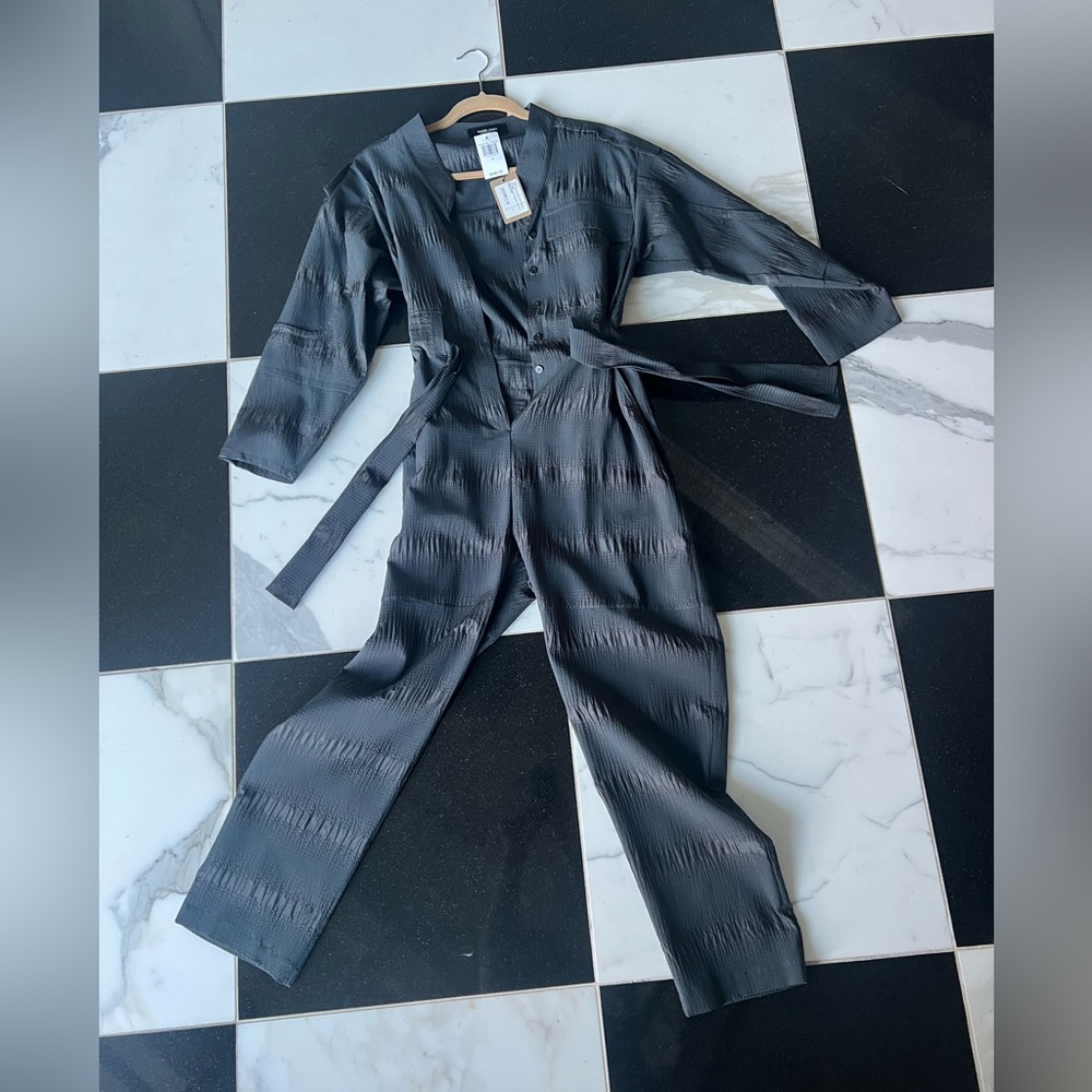 Beautiful lightweight material jumpsuit brand new with tags size 4